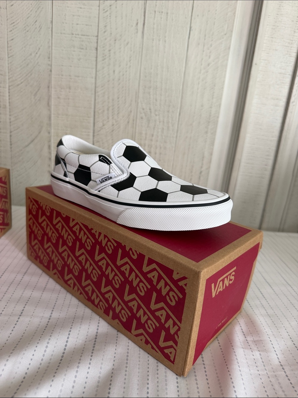 Vans Kids Slip-On Sneakers in White and Black Soccer Print